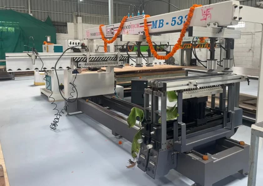 Aakar Modular's workshop with a decorated panel-processing machine